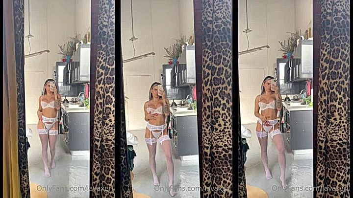 hot babe Lavaxgrl showing off her bikin in the mirror