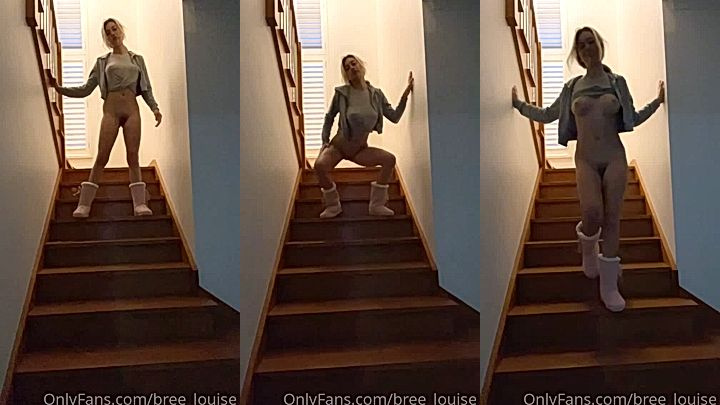 naked hoe Bree Louise teases her big tits as she goes up the stairs