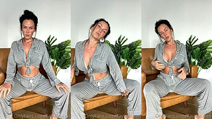 hot babe Kayla Lauren rubbing her boobs while sitting on the chair