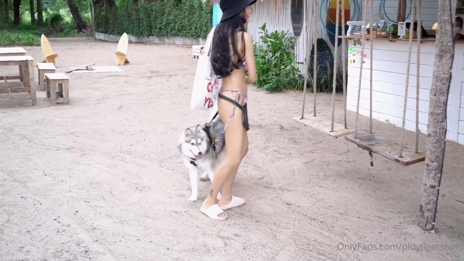 sexy model Ploytigerstam takes her dog on a walk in bikini