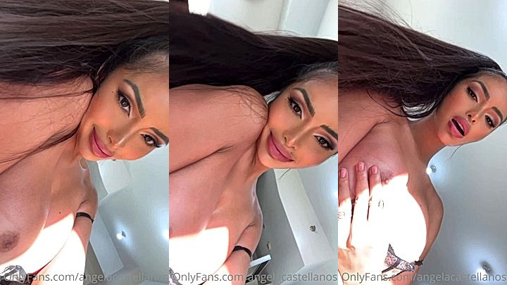 freaky girl Angela Castellanossmile at you as she teases you with her huge tits