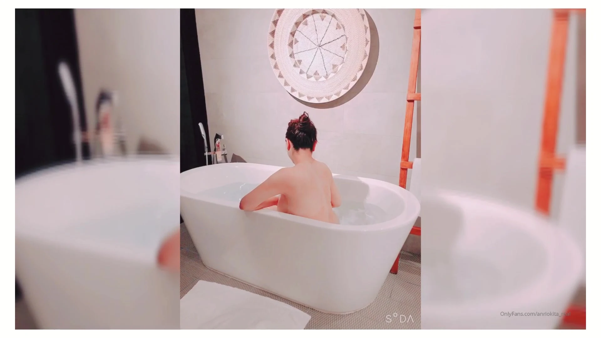 Anri Okita is having a great time in the Jacuzzi all alone