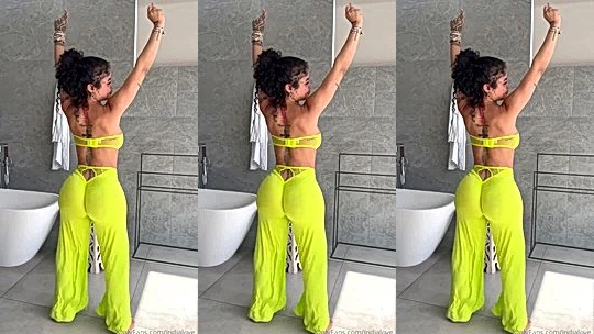 Indialove in her neon sexy dress is having a great time teasing her fans