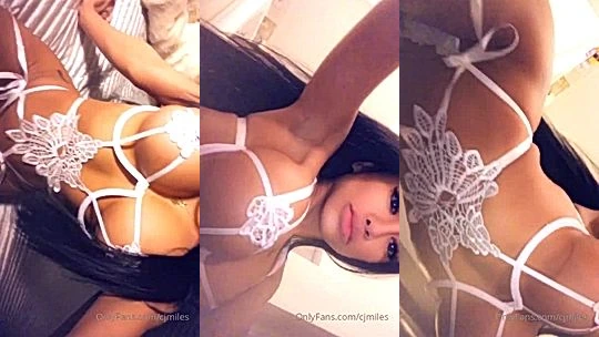 busty big tits stepsister CJ Miles sitting on the bed while touching herself