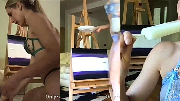 onlyfans model Caroline Zalog lays on the floor painting big ass