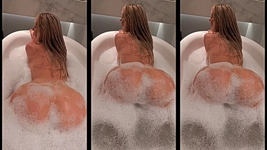 busty onlyfans model Amanda Toy shakes her big booty in the soapy tub