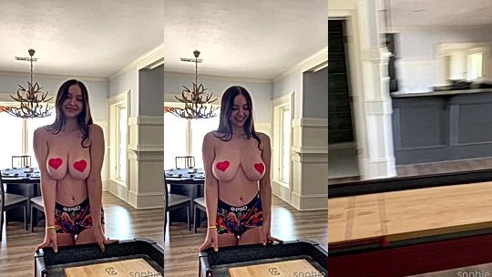 naughty sexy hot model Sophie Muddlet her big boobs hang loose as she have fun in teh game room