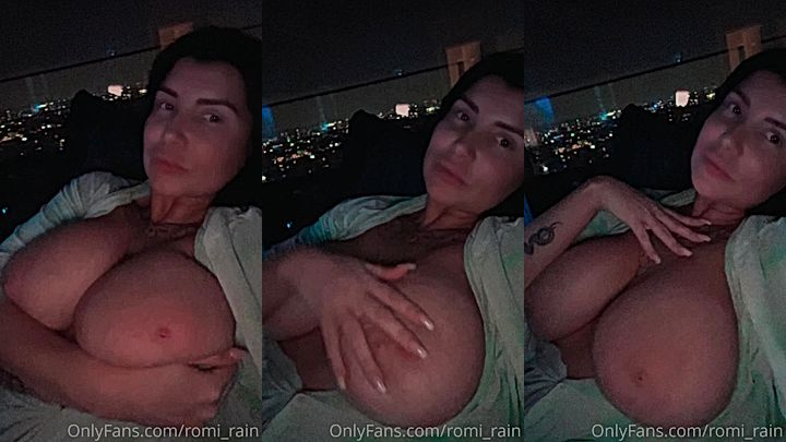 hot naughty sexy model Romi Rain on the balcony rubbing her big juicy tits