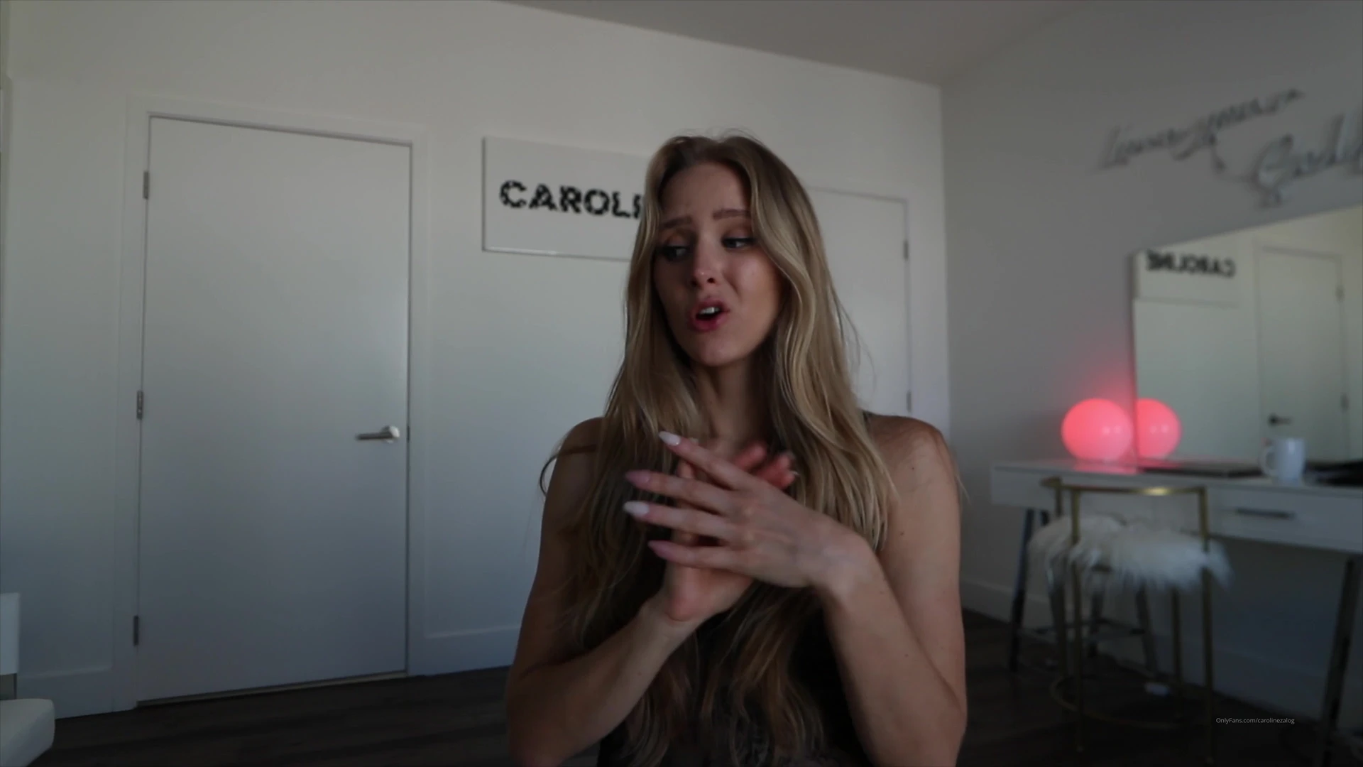 naughty american model Caroline Zalog undresses in her bedroom just for you