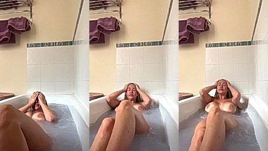 sexy hot model Sophie Readeust took a shower and let her massive big boobs hang loose , she needs someone to squeeze and garb em hard till she cums